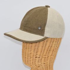 a brown and white hat sitting on top of a head