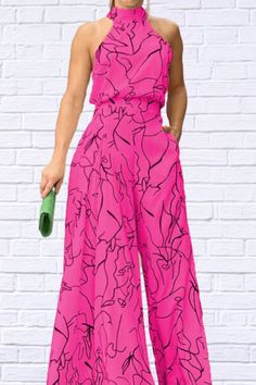 Look stunning in this summer jumpsuit from Diva USA. The high neckline, wide leg pants with side art print and body con fit will make you feel chic and fashionable while keeping it comfortable for those hot summer days! Get free shipping today on orders over $50. Make a bold statement with the Diva USA Women's Jumpsuit. With a high neckline and chic wide leg pants featuring a side art print, this jumpsuit exudes sophistication and elegance. The body con fit ensures a flattering and comfortable f Chic Wide Leg Pants, Women's Jumpsuit, Summer Jumpsuit, Smart Casual Wear, Women Jumpsuit, The Diva, Jumpsuit Summer, Printed Jumpsuit, Unique Outfits