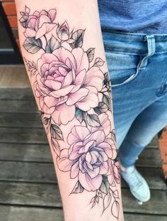 a person with a flower tattoo on their arm