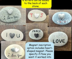 some rocks with hearts and words on them