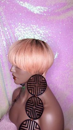 Celebrity Inspired Style Bowl Pixie Cut Brazilian Remy 100%Human Hair Wig Everyone wants the wig that you can place on your head and go without the worries of styling. This is the perfect wig to have in your wig closet. Remember the 90s haircuts that were so cool, sleek, sassy, and the ultimate attention getter. This wig is so cute and stylish! Brazilian Remy 100%Human Hair Soft and nice luster Density= 130% Average fit comfortable and breathable cap. Short pixie style that requires little to no Blonde Hair Wig, Wig Closet, 90s Haircuts, Puffy Hair, Perfect Lip Color, Funky Hair, Pixie Cut Styles, Remy Human Hair Wigs, Pixie Styles