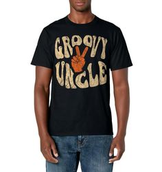 PRICES MAY VARY. Groovy Uncle is a cool 70s nostalgia design featuring a 1970's vintage retro style graphic. A special design for an uncle who loves the seventies and is nostalgic about them. Get this "Groovy uncle" 70s vibe design for your loved uncle who is a 70s kid raised in the 70s to wear proudly casually and also on occasions like fathers day. Lightweight, Classic fit, Double-needle sleeve and bottom hem Retro Graphic Design T-shirt For Spring, Unisex Retro T-shirt With Text Print, Groovy Graphic Print Short Sleeve T-shirt, Unisex Retro Summer T-shirt, Vintage Unisex T-shirt For Spring, Unisex Vintage T-shirt For Spring, Retro Cropped T-shirt With Letter Print, Hippie Cotton T-shirt With Retro Print, Groovy Cotton Tops For Streetwear