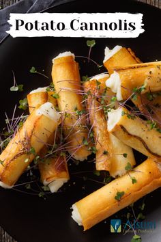 some food is on a black plate with green sprouts