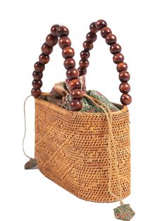 Imagine a woven rattan bag with a simple yet captivating twist: a natural beaded handle. The bag's woven texture adds a touch of rustic appeal, while the beads on the handle provide a subtle, earthy accent. This combination of materials creates a charmingly balanced accessory that effortlessly complements various outfits and occasions, making it a versatile and stylish addition to your collection.
 Size: One Size Brown Braided Rattan Shoulder Bag, Rectangular Brown Braided Straw Bag, Brown Braided Rectangular Straw Bag, Eco-friendly Brown Braided Shoulder Bag, Brown Bohemian Straw Bag With Open Weave, Brown Braided Natural Fiber Shoulder Bag, Brown Braided Rattan Straw Bag, Brown Jute Straw Bag With Braided Details, Brown Braided Jute Straw Bag