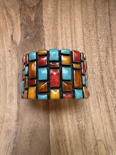 New without tags* JEWELRY TYPE : Bracelets  * MAIN STONE : Turquoise   * STYLE : Cuff     Handmade Sterling Silver Multi Stone Cuff Bracelet.  The stones are absolutely incredible.  This beauty is 1 3/4 inch wide. It has an inside circumference of 6 inch with a 3/4 inch gap.    Stamped 925.  Thank you for checking us out. Please contact us if you have any questions.  6/3/24    Exported By ExportYourStore :) SKU:450606279231_9F37* Native American Bracelets, Sterling Silver Cuff Bracelet, Sterling Silver Cuff, Silver Cuff Bracelet, Multi Stone, Silver Cuff, Handmade Sterling Silver, Sterling Silber, Arm Band