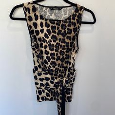 Nwot Zara Animal Print Crew Neck Sleeveless Top. Ties At Waist. Size Xs. Never Worn. Excellent Condition Zara Fitted Tank Vest, Chic Zara Sleeveless Tank Top, Chic Sleeveless Zara Tank Top, Zara Fitted Casual Vest, Fitted Sleeveless Brown Top, Fitted Tank Top By Zara, Fitted Zara Tank Top, Casual Sleeveless Leopard Print Top, Fitted Leopard Print Cami Tank Top