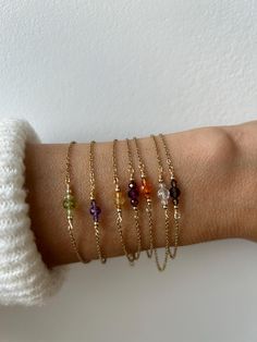 This dainty gemstone bracelet is perfect for the minimalist. Personalise it by choosing the crystal and chain of your choice. D E T A I L S *It features a trio genuine gemstone crystals . The middle bead measures between 3 and 4mm and the smaller ones between 2 and 2.5mm respectively. *They has been wire wrapped to a  dainty stainless steel chain that will not tarnish. Choose between gold, silver or rose gold. *Bracelet comes with a crystal information card and is ready for gifting. S I Z I N G 4mm Crystal Bracelet, Dainty Yellow Gold Chain Bracelet With Gemstone, Dainty Gold Crystal Bracelet With Gemstone, 14k Gold Filled Gemstone Bracelet, Dainty Birthstone Gemstones For Gifts, Elegant Gemstone Chain Bracelet As Gift, Minimalist Gold Bracelet With Gemstone, Minimalist Gold Chain Bracelet With Gemstone, Minimalist Gold Bracelets With Gemstones