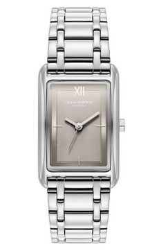 A minimalist dial adds streamlined elegance to a slim rectangular watch set on a gleaming bracelet for luxe appeal. 23mm case; 18mm band width Deployant clasp closure Quartz movement Stainless steel or stainless steel with goldtone plate Imported Classic Watches With Rectangular Metal Dial, Classic Rectangular Metal Dial Watch, Classic Square Face Watch With Metal Dial, Classic Analog Rectangular Watch Accessories, Classic Rectangular Watches For Work, Classic Rectangular Workwear Watches, Classic Rectangular Watches For Workwear, Classic Everyday Rectangular Watch Accessories, Classic Rectangular Watch Accessories For Everyday