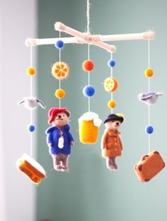 a mobile made to look like stuffed animals hanging from the ceiling with food and drinks on it