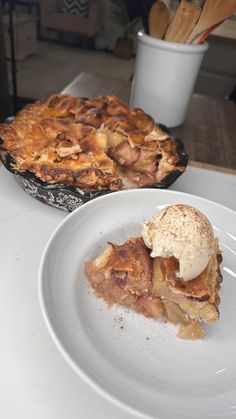 two pies sitting on top of a table next to each other, one with an ice cream