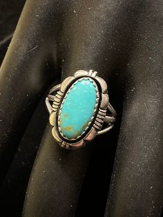 Fine vintage woman's sterling and turquoise ring with detailed work by Lee (Leo) Yazzie, a famous Navajo artist belonging to the Yazzie family known for their fine Native American jewelry for many years. Size 8. Stone from Kingman Mine, Arizona. Antique Silver Turquoise Ring With Patina, Western Style Turquoise Ring Collectible, Vintage Sterling Silver Turquoise Ring With Inlay, Western Style Oval Turquoise Inlay Ring, Western Oval Turquoise Ring With Inlay, Vintage Hallmarked Turquoise Ring, Western Style Oval Turquoise Ring With Inlay, Vintage Hallmarked Turquoise Ring For Collectors, Vintage Concho Ring Jewelry