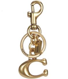 a gold metal keychain with a hook and chain attached to the front of it