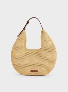 Beige Ida Knitted Hobo Bag | CHARLES & KEITH Modern Woven Hobo Bag With Double Handle, Modern Woven Double Handle Hobo Bag, Modern Woven Shoulder Bag, Modern Beige Woven Straw Bag, Modern Beige Straw Bag, Modern Recyclable Shoulder Bag For Shopping, Modern Natural Straw Bag, Eco-friendly Hobo Bag With Adjustable Strap, Beige Recyclable Tote Shoulder Bag