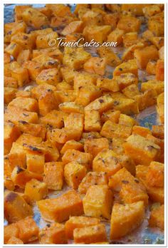 roasted butternuts on a baking sheet ready to be cooked