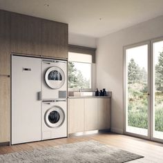 a washer and dryer in a room with wood flooring on the walls