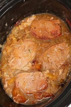 the meat is being cooked in the slow cooker