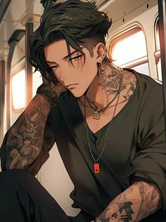 a man with black hair and tattoos sitting on a train looking at his cell phone