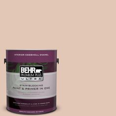 a can of behr paint on a white background