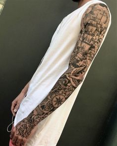 a man with tattoos on his arm and arms