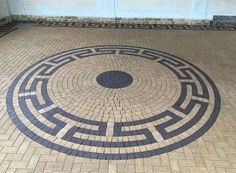 a circular design on the ground in front of a door