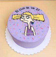 a purple cake with a cartoon character on it