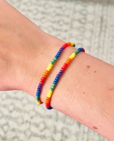 "Set of two colorful stretch rainbow bracelets for the perfect pop of color! Mix and match them with your own bracelets or pair them with our stretch or leather wrap bracelets. LOVE for all! You will receive TWO rainbow bracelets!   These bracelets feature vibrant rainbow 8/0 round seed beads that are strung on quality stretch cord.   Available in multiple sizes: xs 6\"  s/m 6 1/2\"  m/l 7\"  and  xl 7 1/2\" Please keep in mind, you'll want to size up 1/2\" from your actual wrist size to allow the bracelet to stretch over your hand and have a bit of movement on your wrist.   If you need a different size, please leave a message in the notes. Handmade in Hell's Kitchen, New York City." Letter Bracelets, Leather Wrap Bracelets, Hell's Kitchen, Letter Bracelet, Rainbow Bracelet, Wrap Bracelets, Color Mix, Letter Beads, Seed Bead Bracelets