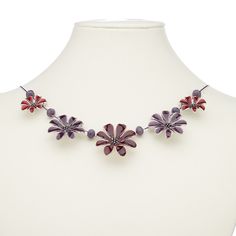 Ready-to-wear necklace features multicolored flowers and silver-plated brass. Colors, shapes and sizes may vary in each lot. Red Jewelry With 3d Flower Details, Red Adjustable Flower Necklace, Red Enamel Necklace Nickel Free, Red Enamel Nickel-free Necklaces, Red Enamel Nickel-free Necklace, Adjustable Purple Flower Necklace, Nickel Free Purple Metal Necklace, Red Necklace With Flower Charm Pendant, Nickel-free Purple Metal Necklace