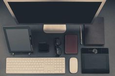 a desktop computer sitting on top of a desk next to a keyboard and mouse in front of a monitor