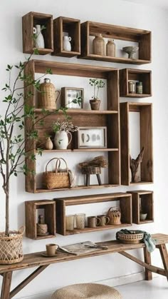 a wooden shelf with baskets and plants on it