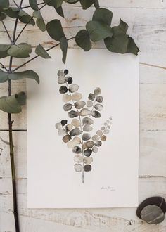 a white paper with some leaves on it