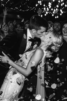 The groom in a green velvet tuxedo kisses the bride as she leans back for their first dance with confetti exploding Green Velvet Tuxedo, First Kiss Wedding, Wedding Photography Shot List, First Dance Wedding, First Dance Photos, Farm Wedding Photography, Confetti Photos, Velvet Tuxedo