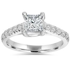 a princess cut diamond engagement ring with pave set diamonds on the band and shoulders