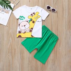 Baby Boys Letter Animal Printed Short Sleeve Tee & Shorts Baby Wholesales - PrettyKid Cartoon Print Cotton Short Sets, Cotton Cartoon Print Short Sets, Matching Green Summer Sets, Green Matching Sets For Summer, Green Cotton Sets With Cartoon Print, Green Cartoon Print Summer Sets, Green Casual Sets With Cartoon Print, Casual Green Sets With Cartoon Print, Green Cartoon Print Sets For Spring