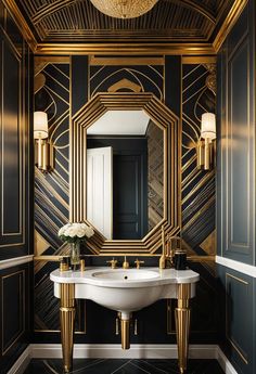 a bathroom with black and gold walls, a white sink and a large mirror on the wall