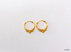 18kt gold hoop earring pair from rajasthan india. nice handmade design made of 18kt yellow gold, good for jewelry collection. Best gift item. Note - Please check pictures carefully for more details. Height - 2 cm Width - 1.65 cm Weight - 1.020 grams Material - 18kt yellow gold. Hallmarked Round Earrings For Puja, Handmade Gold Hoop Earrings Temple Jewelry, 22k Gold Hoop Jewelry For Festive Occasions, Handmade Gold Earrings For Puja, Traditional 14k Gold Earrings, Traditional Small Hoop Hallmarked Earrings, Gold Plated Round Hoop Earrings Temple Jewelry, Gold Plated Round Hoop Earrings In Temple Jewelry Style, Traditional Small Hoop 22k Gold Earrings