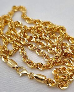 --- Crafted in GUARANTEED HIGH-QUALITY 18-Karat GOLD -- Pure Gold Material, Not Gold-Filled or Plated --- ** Chain options base on their lengths, thickness and weights: 16 inches - 4 millimeters: 6.70 grams 18" - 4 mm : 7.55 gr  20" - 4 mm : 8.39 gr 22" - 4 mm : 9.21 gr 24" - 4 mm : 10.07 gr 26.5" - 4 mm : 11.00 gr Closure: Lobster Claw ( Strong and Durable ) Chain style: Rope Chain, Diamond-cut, 18K Gold Please feel free to message me for any custom sizing! *About 18K Gold: 18K gold pieces are crafted to last a lifetime. When it comes to quality and luxury, 18K gold jewelry stands at the top. It's resistant to rubbing off, flaking, and tarnishing, ensuring that your investment maintains its brilliance over time. Plus, real gold only becomes more valuable with age, making it not just a pur Chain Diamond, Chain For Men, Gold Rope Chains, Rope Chain Necklace, Gold Chains For Men, Precious Jewels, Women Birthday, 18k Gold Jewelry, Gold Piece