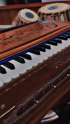 an old piano with musical instruments in the background