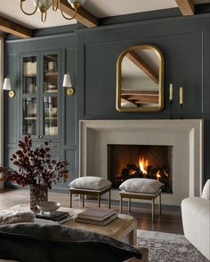 a living room filled with furniture and a fire place