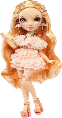 a doll with long blonde hair and big blue eyes is standing in front of a white background