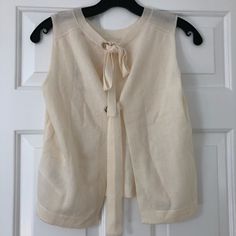 Brand New With Tags. Designer Size 1. Cream Colored. Chic Spring Sweater For Daywear, Chic Spring Daywear Sweater, Elegant Spring Sweater For Daywear, Elegant Cashmere Knit Top For Layering, Chic Knit Top For Daywear, Chic Fine Knit Tops For Daywear, Chic Cream Sweater Vest For Spring, Chic Beige Sweater For Daywear, Elegant Beige Sweater Vest For Fall