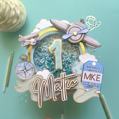 Time Flies / Onederful World Cake Topper DulceMielCrafts' vintage airplane cake topper is the perfect addition to your cake and decor! this topper features retro airplanes, gold lined clouds, compass, globe and a luggage tag that is customized to match the city you're celebrating from or your baby was born in!  Name, age and luggage tag are fully customized.  All colors can be changed to fit your color scheme.  If you have any questions before ordering please message me and I will provide you wi Vintage Airplane Cake, Time Flies Cake, Travel Cake Topper, Airplane Cake Topper, Bon Voyage Cake, Retro Airplane, World Cake, Airplane Cake, Travel Cake