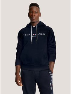 Tommy Hilfiger men's hoodie. Made from soft, brushed-back fleece with a flat, clean face and smooth handfeel, our regular-fit Tommy logo hoodie is just as comfortable as it is cool.  Material: 70% Better Cotton Initiative (bci) Cotton, 30% Polyester - Conventional. Hooded Fleece Hoodie With Logo Print, Tommy Hilfiger Sporty Hoodie For Streetwear, Tommy Hilfiger Logo Print Sweatshirt For Streetwear, Tommy Hilfiger Cotton Hoodie Sweatshirt, Tommy Hilfiger Winter Hoodie, Fleece Hoodie With Embroidered Logo, Tommy Hilfiger Hooded Hoodie With Drawstring, Tommy Hilfiger Hoodie With Drawstring Hood For Streetwear, Tommy Hilfiger Hoodie With Drawstring Hood