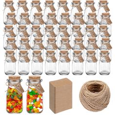 a bunch of glass jars filled with different types of candies next to twine