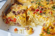 a casserole dish with meat and vegetables in it, ready to be eaten