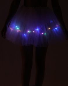 Give them a glimpse of paradise with the Heaven On Earth Light Up Tutu. This buttery soft tulle skirt comes in white and pink, is sewn in an elastic waistband, and features attached LED lights. Light Up Tutu, Body Chain Harness, Chain Harness, Couples Accessories, Glitter Glasses, Festival Gear, Fairy Dresses, Face Gems, Festival Shop