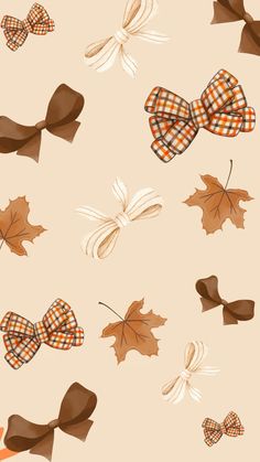 several bows and leaves on a beige background