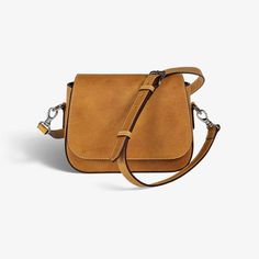 "Stay hands-free and stylish with our women's crossbody bag. Find the perfect accessory to complete any look, whether you're dressed up or down. Carry your essentials in style with a timeless accessory that will never go out of fashion. ✦ Italian Leather: Full-grain vegetable tanned ✦ Fabric interior with leather accents ✦ Magnetic closure ✦ Internal zippered compartment ✦ Polished nickel hardware  ✦ Leather Strap: Adjustable drop (19.5\" - 25.5\") ✦ Strap width: 0.75\" ✦ Weighs 1 lb 4 oz ✦ Dime Minimalist Crossbody Satchel With Detachable Strap, Rectangular Saddle Bag With Adjustable Handle, On-the-go Saddle Bag With Adjustable Handle, Minimalist Crossbody Flap Bag With Detachable Strap, Minimalist Crossbody Flap Bag For Travel, Minimalist Crossbody Flap Bag For Daily Use, Minimalist Crossbody Satchel With Adjustable Strap, Minimalist Crossbody Shoulder Bag With Adjustable Strap, Minimalist Flap Bag With Detachable Strap