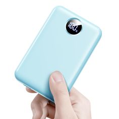 a person holding a blue cell phone in their right hand and pressing the button on it