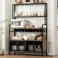 a microwave and some food on a shelf in a room with a potted plant