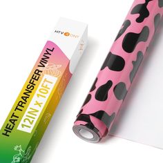 a roll of pink and black animal print wrapping paper next to an empty carton